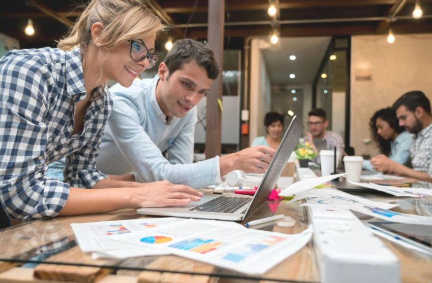 Marketers reviewing data in a conference room