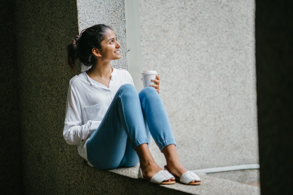 a caregiver on break enjoying her coffee to avoid caregiver burnout