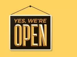 Bild eines "Yes, we're open"-Schildes, das hell schwingt. DTC-Marketing: Direct-to-Consumer-Händler können durch Echtzeit-Engagement massive Zuwächse beim E-Commerce-Umsatz erzielen.