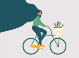 Kobieta na rowerze, która pokazuje, jak opłacalność zrównoważonego rozwoju firmy może sprawić, że rentowność będzie trwała.
